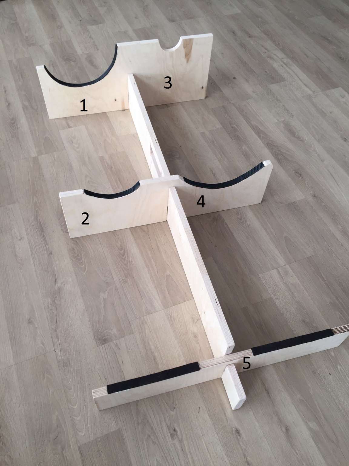 Wooden assembly stand with numbered positions