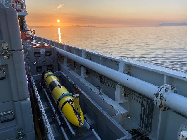 Glider on deck with a clear view of the sky, placed well ahead of deployment